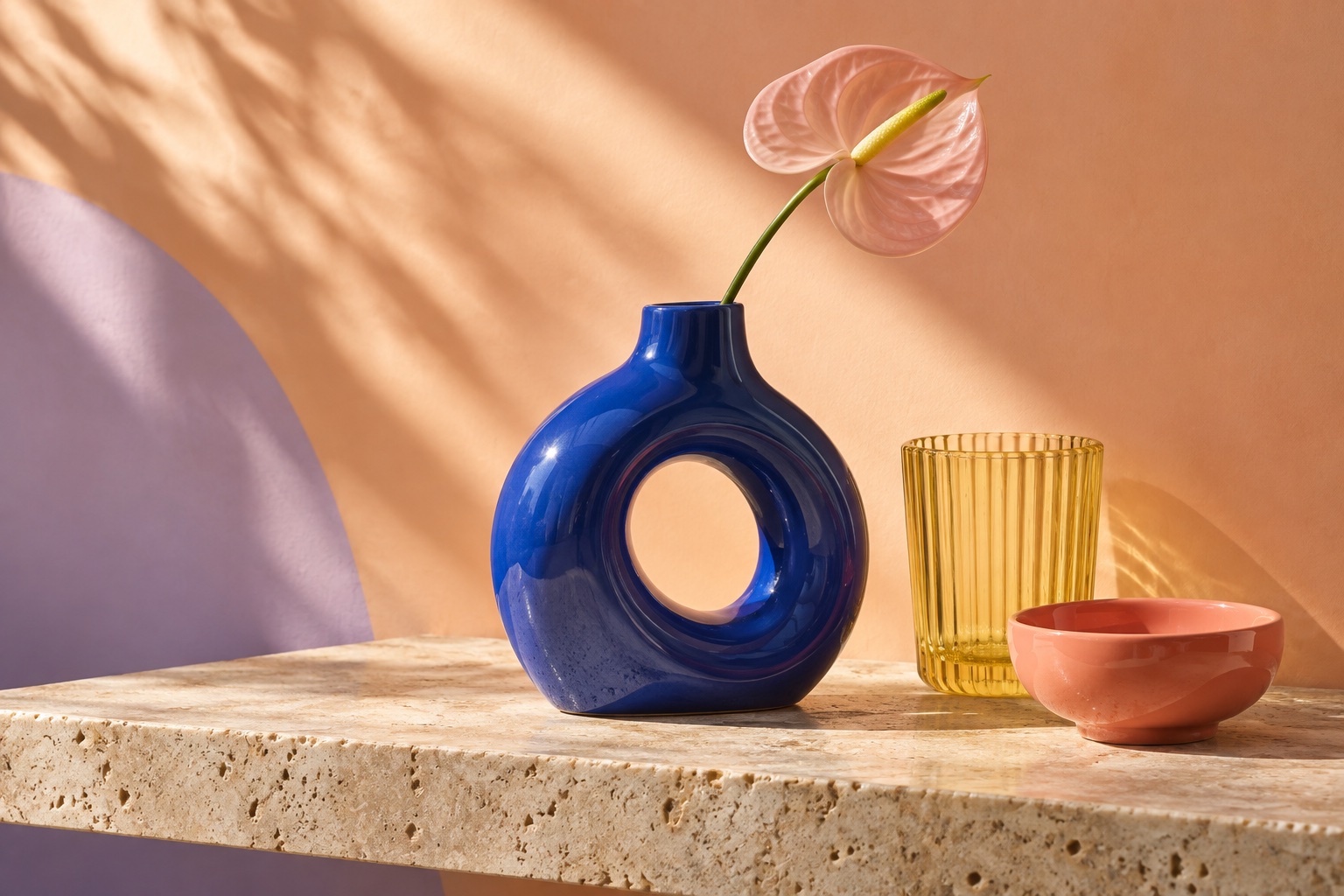 Blue ceramic vase, amber glass and coral bowl from the sample Forma collection